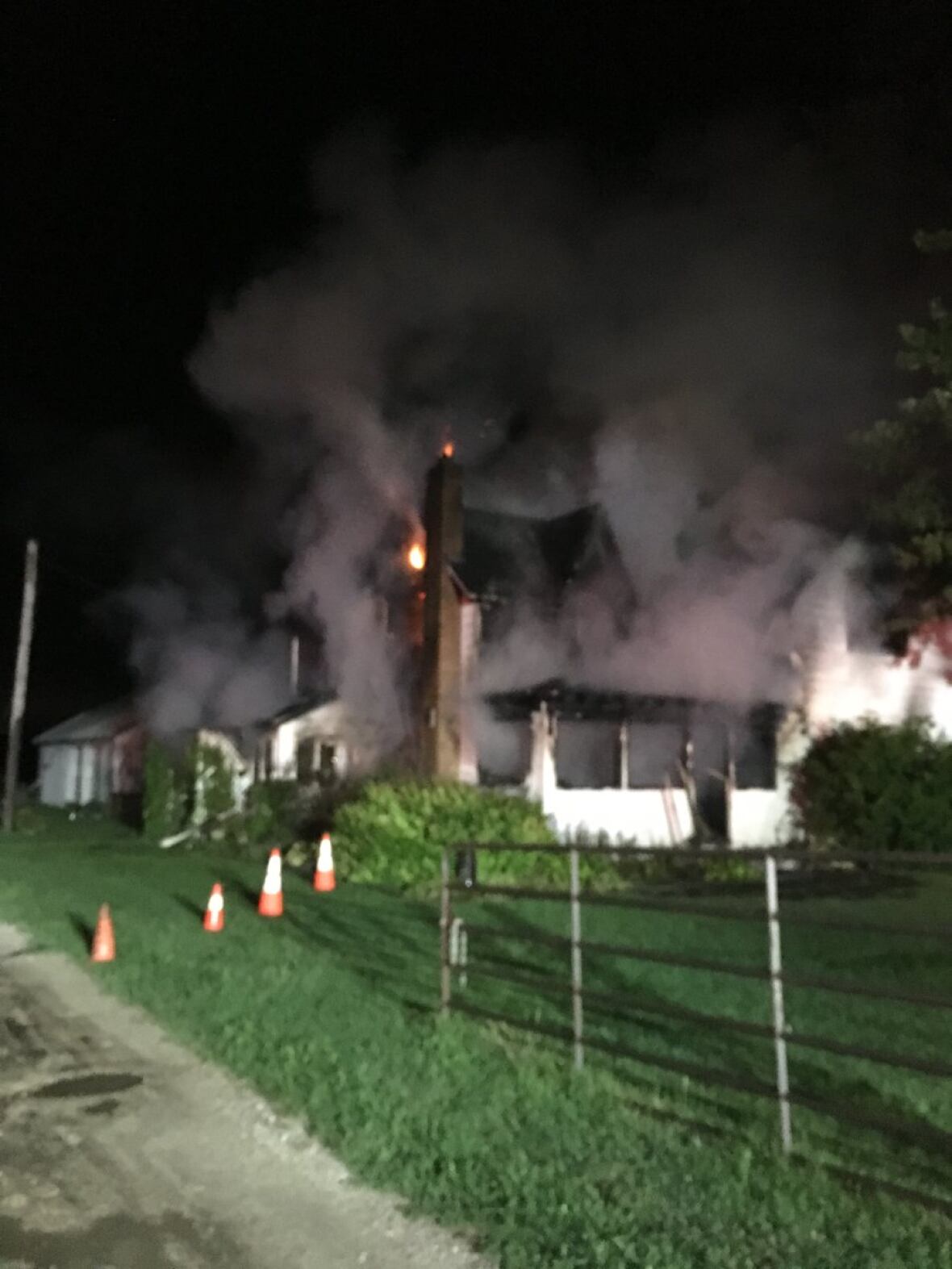 Crews battle Essex house fire closing section of County Road 12 CBC News
