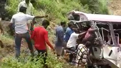 Rescuers pull out passengers from a bus that fell into a gorge in Jagtiyal district of Telangana, India, on Tuesday, Sept. 11, 2018. The bus was carrying pilgrims from a Hindu temple in the hills of south India when it plunged off a road. India Bus Crash