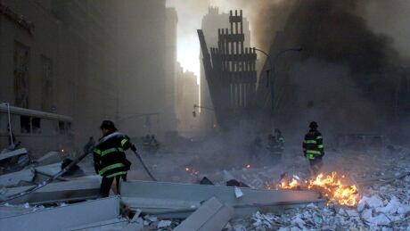 Firemen work around the World Trade Center after both towers collapsed in New York, in this file picture taken September 11, 2001. Al Qaeda leader Osama bin Laden was killed May 1, 2011, in a firefight with U.S. forces in Pakistan and his body was recovered, President Barack Obama said on May 1, 2011. "Justice has been done," Obama said in a dramatic, late-night White House speech announcing the death of the elusive mastermind of the Sept. 11, 2001, attacks on New York and Washington that killed nearly 3,000 people. REUTERS/Peter Morgan (UNITED STATES - Tags: DISASTER) - GM1E752125601 BINLADEN/