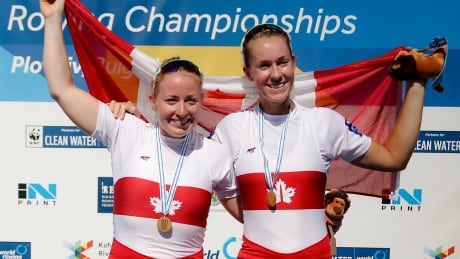 Gold medallists Canada's Hillary Janssens, left, and Caileigh Filmer, right, pose with Canada's flag after winning in the women's pair event at the World Rowing Championships in Plovdiv, Bulgaria, on Saturday. Bulgaria Rowing World Championships