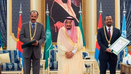 In this photograph released by the state-run Saudi Press Agency, Saudi King Salman, center, receives Eritrean President Isaias Afwerki, left, and Ethiopian Prime Minister Abiy Ahmed, right, in Jiddah, Saudi Arabia on Sunday, Sept. 16, 2018. The leaders of Ethiopia and Eritrea were in Saudi Arabia on Sunday to sign a peace accord between the two East African nations. Ethiopia Eritrea Saudi Arabia