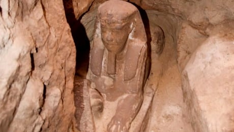 This undated photo released by the Egyptian Ministry of Antiquities, shows the latest discovery of a statue with a lion's body and a human head, in the Temple of Kom Ombo in Aswan, Egypt. The Antiquities Ministry said Sunday, Sept. 16, 2018 that the sphinx made of sandstone was found in the temple during work to protect the site from groundwater. Egypt Antiquities