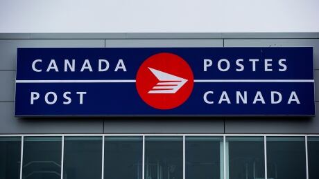The Canada Post logo is seen on the outside the company's Pacific Processing Centre, in Richmond, B.C., on Thursday June 1, 2017. An arbitrator has released a ruling in a long-standing pay equity dispute at Canada Post that gives rural carriers a hefty pay increase. Canada Post Pay Equity 20180920