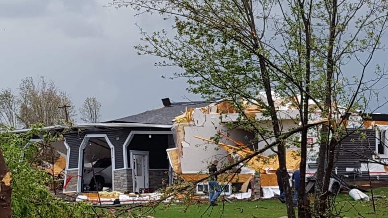 A severely damaged home in Dunrobin in Ottawa's rural west end