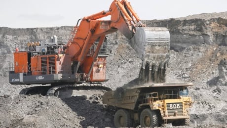 A mining shovel fills a haul vehicle at the Shell Albian Sands oilsands mine near Fort McMurray, Alta., Wednesday, July 9, 2008. Oilsands Costs 20080713