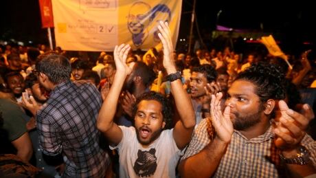 Supporters of Maldivian joint-opposition presidential candidate Ibrahim Mohamed Solih celebrate on the street at the end of the presidential election day in Male, Maldives September 24, 2018. REUTERS/Ashwa Faheem - RC1774C19C00 MALDIVES-ELECTION/
