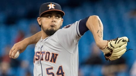 Houston Astros pitcher Roberto Osuna pitches in the ninth inning against the Toronto Blue Jays. astros-jays
