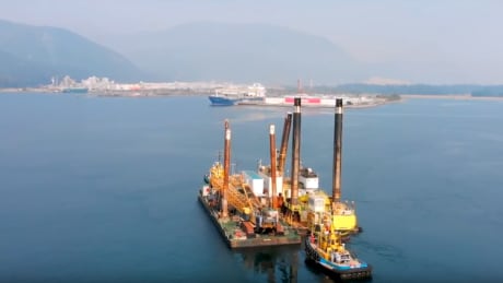 A 34,000-ton heavy lift vessel carrying barges for LNG Canada is completing pre-construction work in Kitimat harbour, to prepare the existing port for larger vessels once the new $40-billion natural gas export facility is constructed. LNG Canada