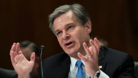 FBI Director Christopher Wray testifies during a hearing of the Senate committee on homeland security and governmental affairs on Capitol Hill, Wednesday, Oct. 10, 2018. Wray says the FBI's background investigation of new Supreme Court Justice Brett Kavanaugh was limited in scope but that the 'usual process was followed.' Congress FBI Kavanaugh