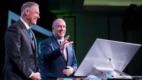 British Columbia Premier John Horgan, right, and Washington State Gov. Jay Inslee at the Cascadia Innovation Corridor Conference in Vancouver on Wednesday, Oct. 10, 2018. Horgan Inslee 20181010