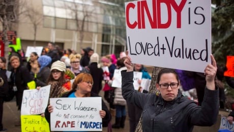 Protesters hold signs in support of Cindy Gladue outside Edmonton's city hall on April 2, 2015. The Supreme Court of Canada is hearing an appeal from Bradley Barton, who was acquitted of murder and manslaughter in her death, then later ordered to face a new trial. Gladue SCOC