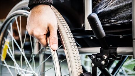 Rich Donovan says there are more than six million Canadians who identify as having a disability who collectively controls $55.4 billion in disposable income. Person in wheelchair