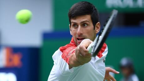 Serbia's Novak Djokovic hits a return against South Africa's Kevin Anderson during their men's singles quarter-final match at the Shanghai Masters tennis tournament on October 12, 2018. (Photo by WANG ZHAO / AFP) (Photo credit should read WANG ZHAO/AFP/Getty Images) djokovic-novak-20181012-1180