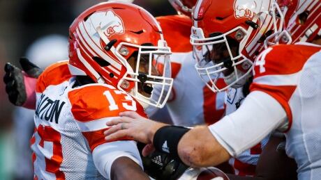 Tyrell Sutton, left, rushed for 106 yards in the B.C. Lions' 26-21 road win over the Calgary Stampeders on Saturday evening. tyrell-sutton