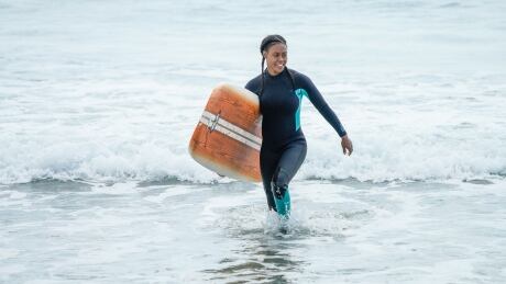 Actress Vinessa Antoine is shown in a surfing scene at Martinique Beach, N.S. for the new CBC crime drama Diggstown. Vinessa Antoine