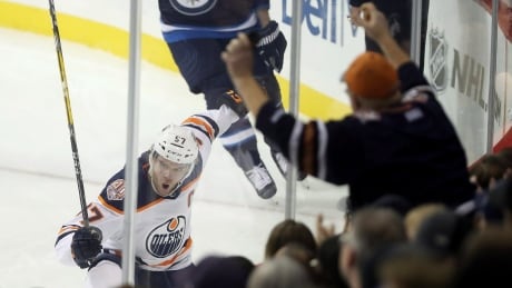 Connor McDavid celebrates after scoring against Winnipeg in the Oilers' overtime win on Tuesday. HKN Oilers Jets 20181016