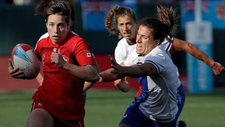 Canada's Ghislaine Landry, left, set the tone early in Saturday's season opener, scoring nine of her team's first 12 points en route to a 26-7 win over Fiji in World Series action. Rugby Sevens