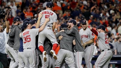 The Boston Red Sox celebrates after winning Game 5 of the American League Championship Series against the Houston Astros on Thursday. sox-astros