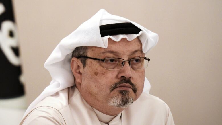 Jamal Khashoggi is seen at a news conference in the Bahraini capital Manama in December 2014