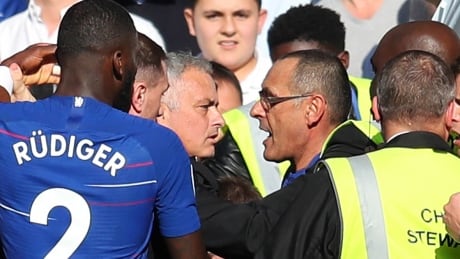 Manchester United manager Jose Mourinho, left, clashes with Chelsea counterpart Maurizio Sarri following a 2-2 draw in Saturday's Premier League match at Stamford Bridge in London, United Kingdom. mourinho-jose-181020-1180