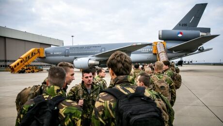 Dutch soldiers depart with a KDC-10 tank and transport device from Eindhoven Airport in Eindhoven in The Netherlands on October 19, 2018 to participate in the NATO (North Atlantic Treaty Organization) exercise Trident Juncture, which will take place in Norway from October 25 to November 23, 2018. (Photo by Remko de Waal / ANP / AFP) / Netherlands OUT (Photo credit should read REMKO DE WAAL/AFP/Getty Images) AFP_1A51DK