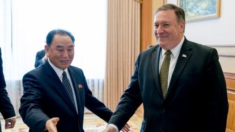 In this July 7, 2018 file photo, U.S. Secretary of State Mike Pompeo, right, and Kim Yong Chol, a North Korean senior ruling party official and former intelligence chief, are shown at a lunch at the Park Hwa Guest House in Pyongyang. Chol's meeting with Pompeo has been delayed, throwing already deadlocked diplomacy over the North's nuclear weapons into further uncertainty. US Koreas Diplomacy