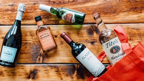 The Drizly mobile app gives consumers access to a store's entire inventory. Drizly liquor delivery app bottles