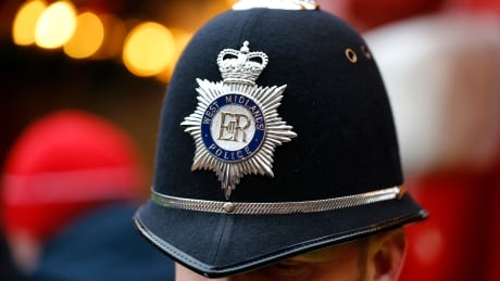 A West Midlands Police officer patrols the German Christmas Market in Birmingham, central England, on Dec. 9, 2014. BRITAIN-POLICE/SAFETY