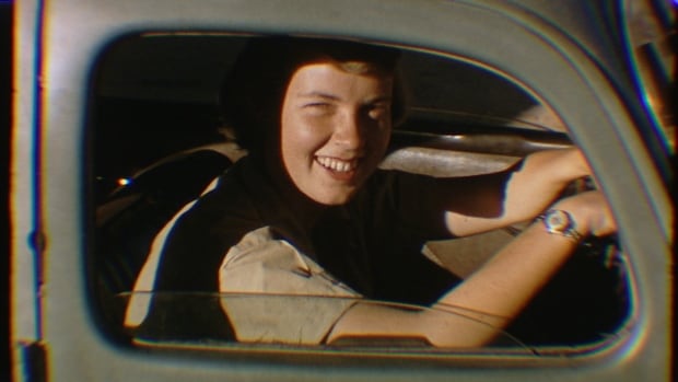 Woman in car in 1956
