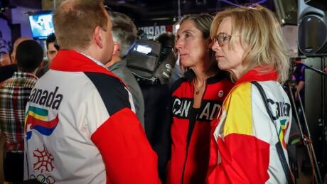 Dave King, left, Linda King, right, the son and daughter of 1988 Calgary bid architect Frank King, react to the results of a plebiscite on whether the city should proceed with a bid for the 2026 Winter Olympics, in Calgary, on Tuesday. OLY 2026 Calgary Bid 20181113