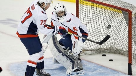 Emergency backup goaltender Gavin McHale faces a shot from Washington forward T.J. Oshie during pregame warmup Wednesday night at Bell MTS Place in Winnipeg. HKN Capitals Jets 20181114