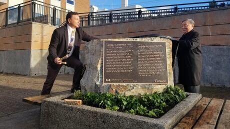 Greg and Henry Shimizu at the plaque dedicated to Shotaro "Tom" Shimizu, who is believed to have donated thousands of cherry trees to the city of Prince Rupert around 60 years ago. Shimizu family plaque