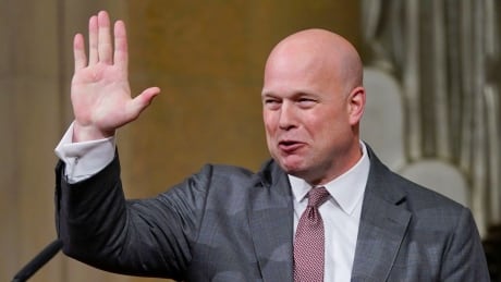 Acting Attorney General Matthew Whitaker gestures after speaking at the Dept. of Justice's Annual Veterans Appreciation Day Ceremony on Thursday, Nov. 15, 2018, at the Justice Department in Washington. Trump Whitaker