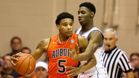 Duke R.J. Barrett defends Auburn's Chuma Okeke in the first half of the Blue Devils' 78-72 win at the Maui Invitational on Tuesday. barrett-rj-112018