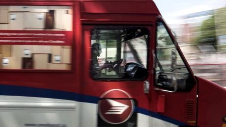 A Canada Post employee drives a mail truck through downtown Halifax on Wednesday, July 6, 2016. The union representing Canada Post employees has launched a new round of rotating strikes in Ontario and Newfoundland and Labrador. Canada Post Rotating Strikes 20181105