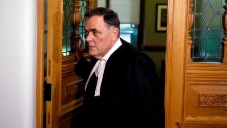 House Speaker Darryl Plecas leaves his office as journalists try to ask him questions outside his office at Legislature in Victoria, B.C., on Thursday, November 22, 2018. THE CANADIAN PRESS/Chad Hipolito Darryl Plecas