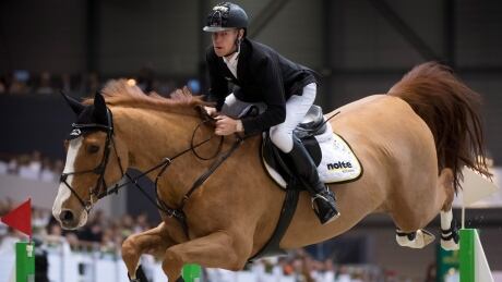 Marcus Ehning of Germany rides his horse Pret A Tout to take first place at the final Rolex Grand Slam of Show Jumping event of the season in Geneva on Sunday. ehning-marcus-120918