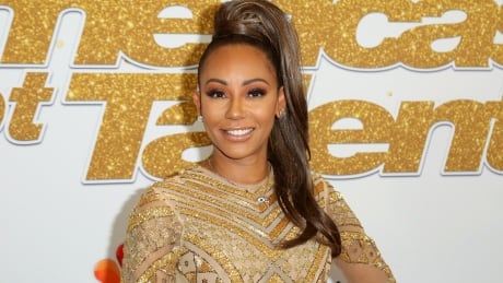 FILE - In this Sept. 18, 2018 file photo, Mel B arrives at the "America's Got Talent" Season 13 Finale Show red carpet in Los Angeles. Brown has suffered an unexplained injury in New York that required surgery to prevent her from losing her hand. Brown said Monday, Dec. 10, she needed three hours of surgery to repair damage to her hand. She also said she suffered two broken ribs. She posted a photograph on Instagram and thanked doctors and nurses for their “wonderful” work but did not explain how the accident occurred. Brown cancelled a book signing event in New York and apologized to fans who had bought tickets. Britain-Spice Girl Injury