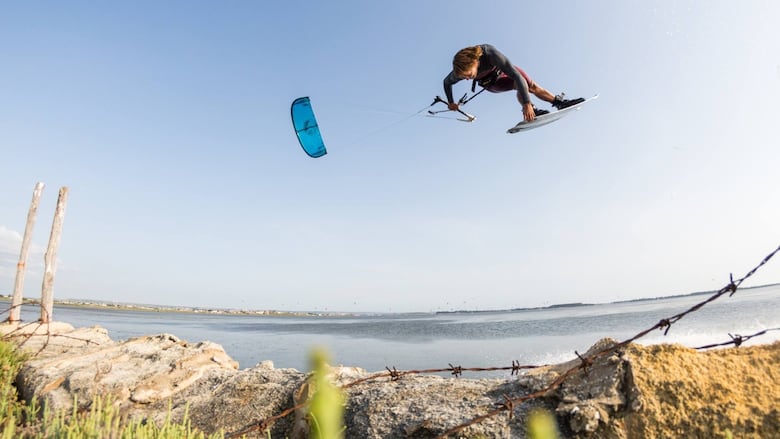 Lucas Arsenault airborne while kiteboarding off the shore of P.E.I.