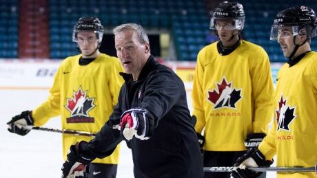 Canadian head coach Tim Hunter has worn many hats throughout his hockey career. tim-hunter