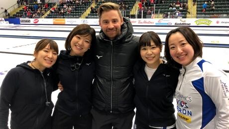 Canadian J.D. Lind, centre, help guide the team he's still coaching today, skipped by Japan’s Satsuki Fujisawa, right, to the country's first-ever medal at the women's world championships. jd-lind