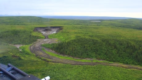 A permafrost slump between the Peel River and Richardson Mountains near Fort McPherson. The researchers took samples from water upstream and downstream of permafrost slumps. Permafrost slump