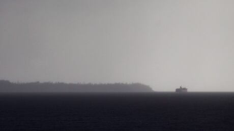 The B.C. Ferries vessel Queen of Burnaby travels across the Strait of Georgia to Comox from Powell River, B.C., under low cloud during a rain storm on March 16, 2017. bc ferries storm