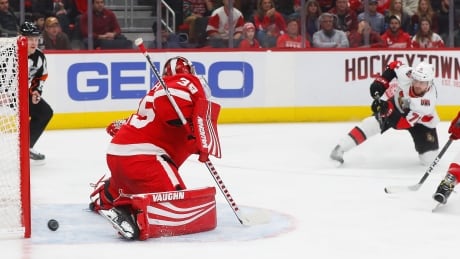 Ottawa's Chris Tierney scores past Detroit goaltender Jimmy Howard on Friday. Senators Red Wings Hockey