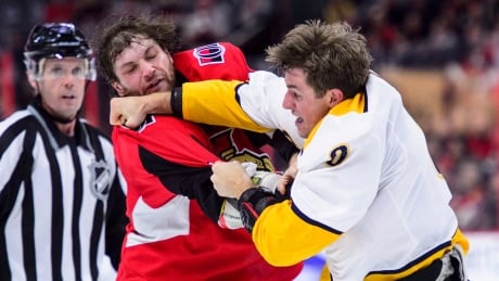 Ottawa's Bobby Ryan, left, fights with former teammate and Nashville Predator Kyle Turris Monday night. HKN Predators Senators 20181217