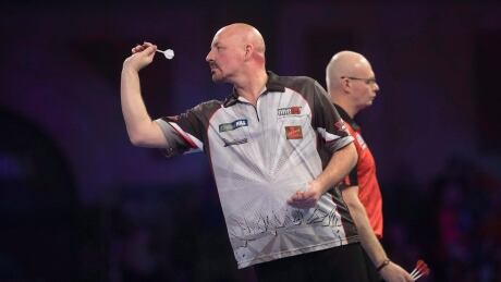 Canadian Jim Long of London, Ont. throws a dart during his first round match, Saturday, Dec.15, 2018 in London, Eng. in a handout photo from the Professional Darts Corporation. THE CANADIAN PRESS/HO-Lawrence Lustig/Professional Darts Corportion MANDATORY CREDIT Darts World Championship 20181215