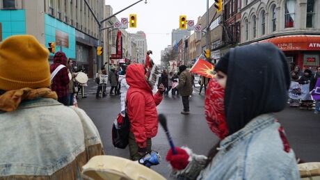 Protesters hold a demonstration at Richmond and Dundas in downtown London Wednesday. It was part of a wider march that saw 150 people march through the streets. Indigenous protesters downtown London