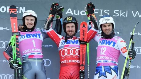 From left, second placed Henrik Kristoffersen, winner Marcel Hirscher and third placed Thomas Fanara celebrate on the podium at the World Cup men's giant slalom race in Adelboden, Switzerland on Saturday. hirsher-alpine-world-cup-011219-620