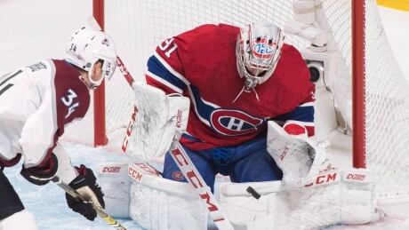 Montreal goaltender Carey Price makes a save against Colorado's Carl Soderberg during first period on Saturday night. HKN Avalanche Canadiens 20190112