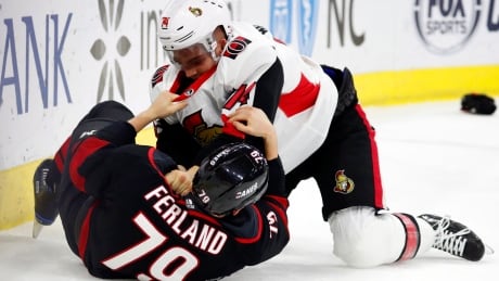 Ottawa Mark Borowiecki (74) tussles with Carolina's Micheal Ferland (79) during the Senators' win on Friday. Senators Hurricanes Hockey